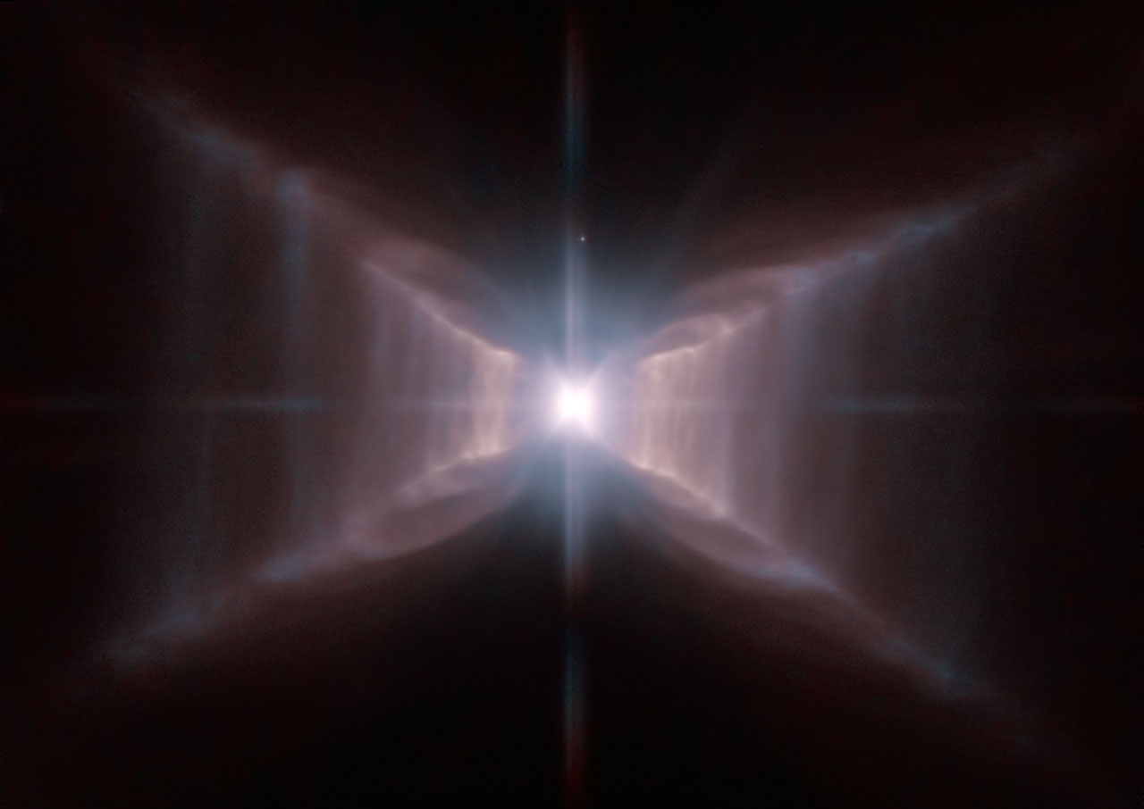 Imagem da estrela HD 44179, cercado por uma estrutura extraordinária, conhecido como Nebulosa do Retângulo Vermelho.