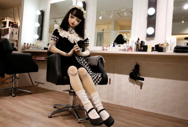 "Doll" model Lulu Hashimoto sits on a chair during an interview with Reuters in Tokyo