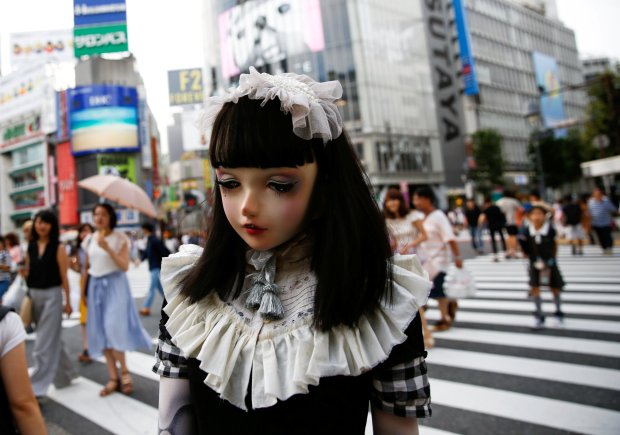 "Doll" model Lulu Hashimoto walks on crosswalk during a photo opportunity for Reuters in Tokyo